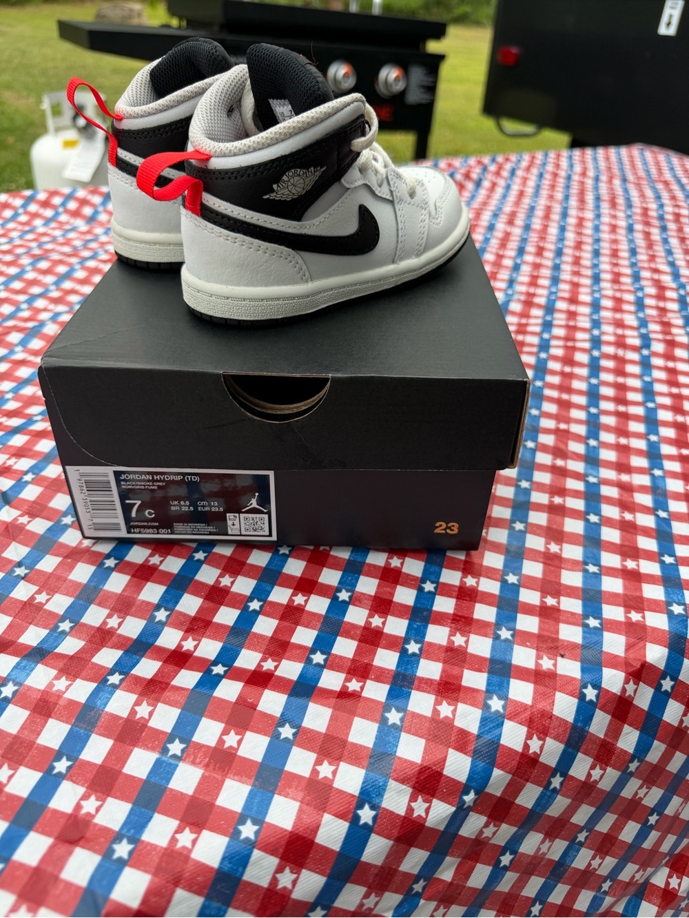Nike Kids White and Black High-Top Sneakers with Red Pull Tab